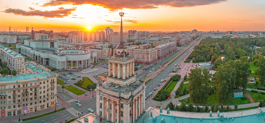 Fototapeta premium Panoramic aerial view of the spire of a high-rise building on Moskovsky Prospect in the city of Saint-Petersburg, evening sunset.