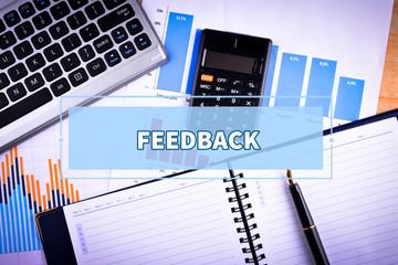 Notebook and Laptop with text FEEDBACK