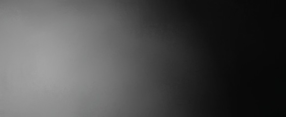 Black and white background with gradient colors of gray in spotlight design with dark border and faint texture © Arlenta Apostrophe