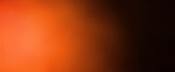 Orange and black background in halloween and autumn colors, bright orange spotlight and black border shadow design