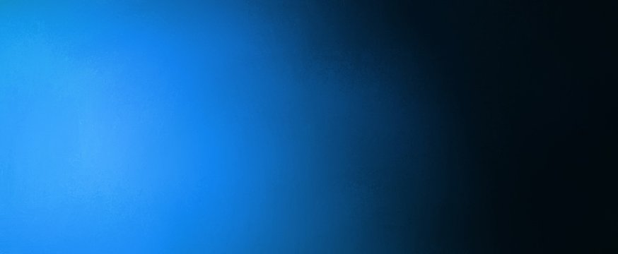 Abstract Blue And Black Background Banner With Bright Blue Spotlight And Gradient Colors With Faint Texture