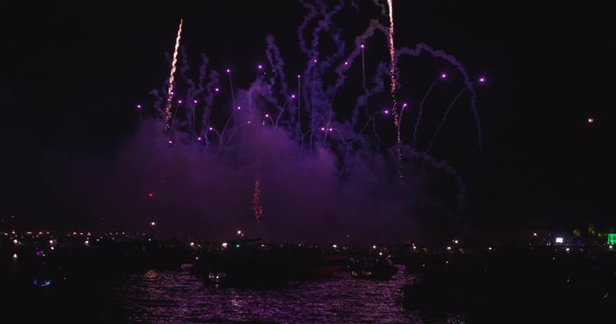 Slow motion of majestic salute in the sky of the redeemer venice Redentore holiday festival fireworks in Venice Italy with offshore yachts.