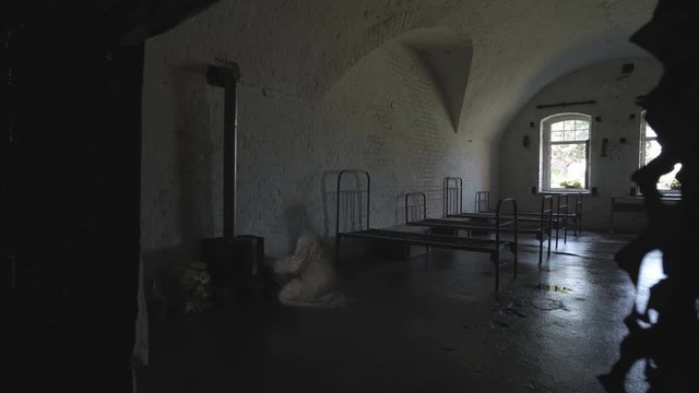 A ghost of a woman wanders in an old abandoned psychiatric hospital.