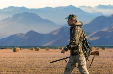 Hunter with a german drathaar and spaniel, pigeon hunting with dogs