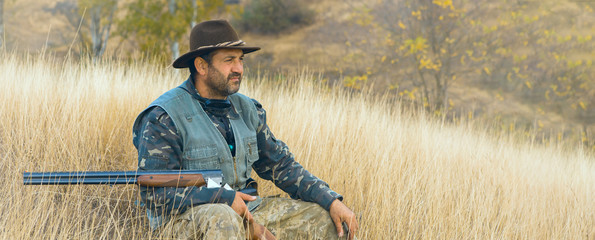 Hunter with a german drathaar and spaniel, pigeon hunting with dogs