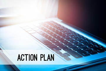 Laptop with sunlight and text ACTION PLAN