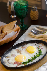 Breakfast. Bacon and Eggs on Cast Iron Skillet