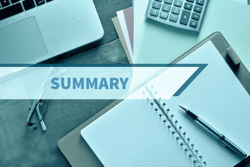 Notebook and Laptop with graph and charts. Financial Concept with word Summary
