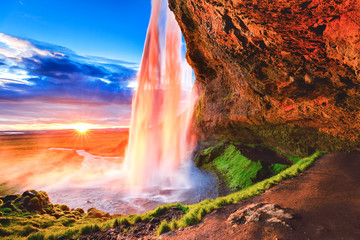 Seljalandsfoss waterfall in Iceland, Europe. Picturesque landscape photography in golden hour, day...