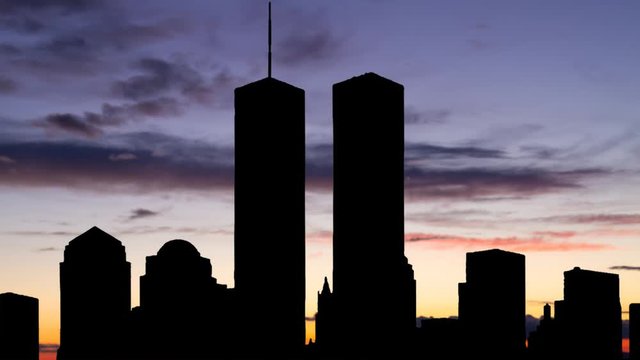 Twin Towers in Silhouette, Time Lapse at Twilight with Colorful Sky and Clouds, Manhattan, New York City, USA