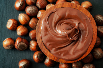 Breakfast food, classic dessert and rustic sweets concept theme with a brown wooden bowl of melted...