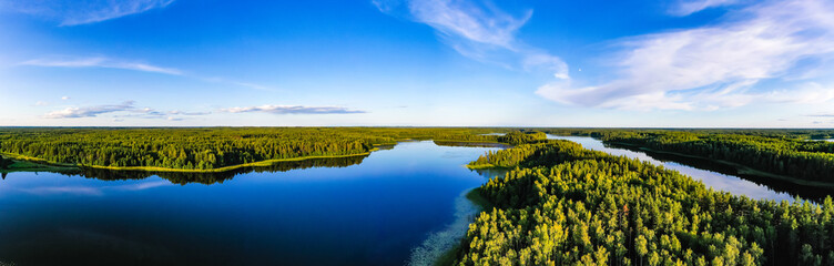 Blue lakes surrounded by green forest, panorama landscape. Ecology concept