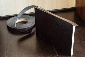 Roll melamine edge for finishing of furniture and laminated chipboard sheets wenge color