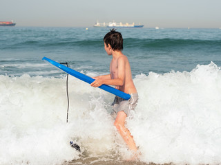 Child with body board