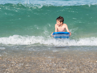 Child with body board
