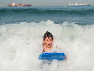 Child with body board