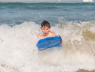 Child with body board