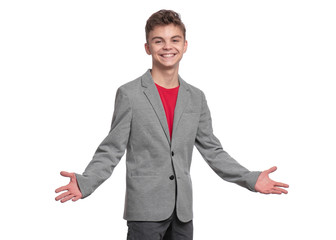 Handsome caucasian Teen Boy in gray suit isolated on white background. Teenager looking at camera and smiling. Happy child - portrait.