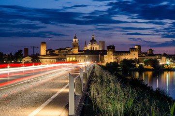 Fototapeta na wymiar Entrance road to the historic centre of Mantua bridge over the River Mincio