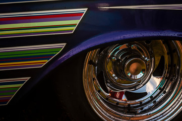 Chrome Wheel of an Old Classic American Muscle Car with Graphic Close-Up.
