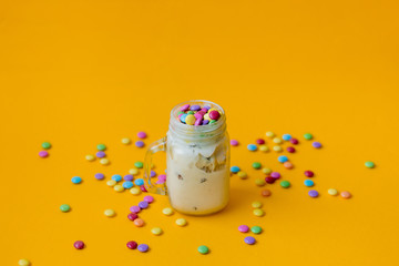 Cup of cream ice-cream with candy in dragee