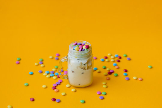 Cup of cream ice-cream with candy in dragee
