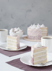 two pieces of cake on white plates