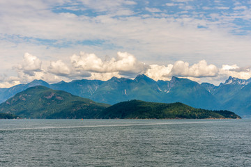 View over Inlet, ocean and island with mountains in beautiful British Columbia. Canada.