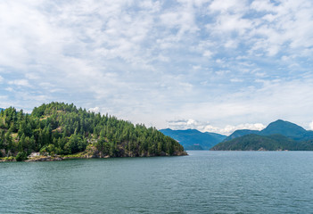 View over Inlet, ocean and island with mountains in beautiful British Columbia. Canada.