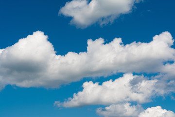 White, Fluffy Clouds In Blue Sky. Abstract Background From Clouds.