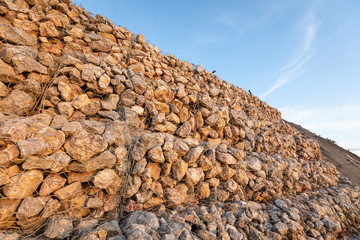 baskets stone dam prevent the destruction of earth and rock beside the high way