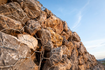 baskets stone dam prevent the destruction of earth and rock beside the high way