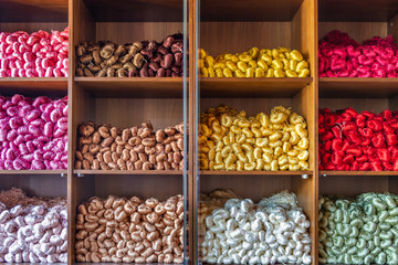 Pure silk yarns in various colors in the shelf