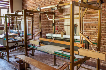 Traditional silk fabric loom. Old method manual fabric weaving machine. No people