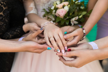 close-up of bridesmaid hands with engagement ring, many bridesmaids hands, consider beauty and admire
