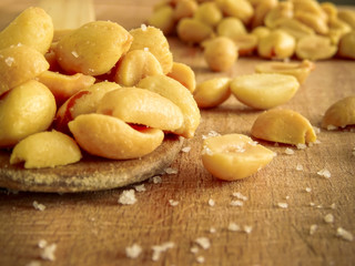 peanut on the wooden and blurry background salty close up