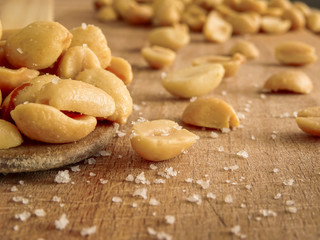 peanut on the wooden and blurry background salty close up