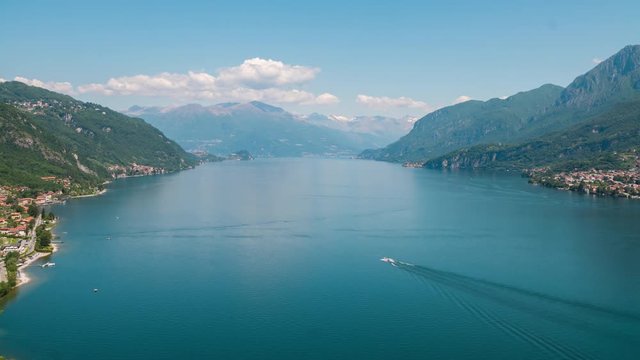 Top view time lapse of lake Como in the north of Italy, one of the most beautiful and deepest lakes in the world, lot of lakeside villages and moving boats