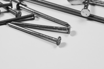 Metal nails isolated on white background. working tools