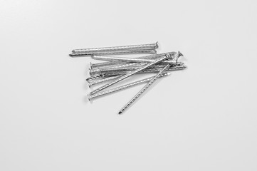 Metal nails isolated on white background. working tools