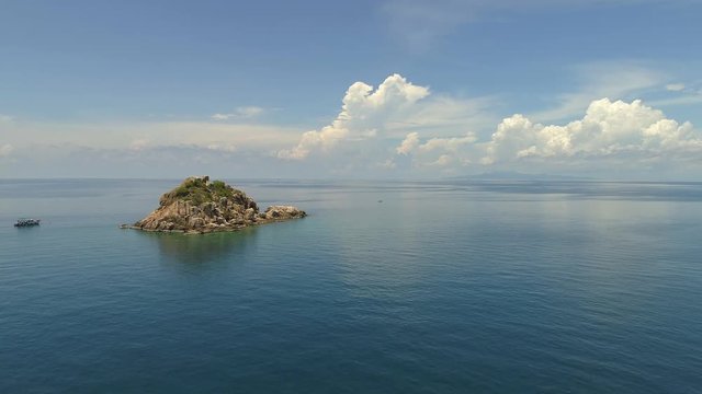Small island under blye sky