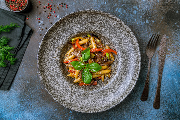 Penne with beef and vegetables and basil