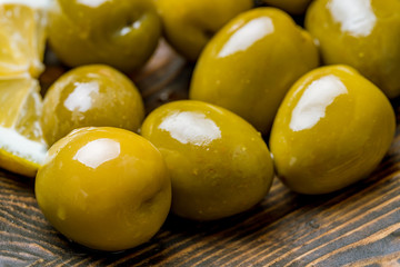 large olives on the board macro closeup