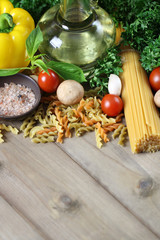 Naklejka na ściany i meble Spaghetti ingredients on wooden, Italian food background.
