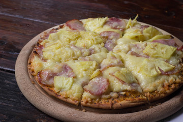 Hawaiian Pizza with coffee shop background