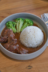 Beef stewed in soy sauce with rice. Cooked beef meat in asian style.