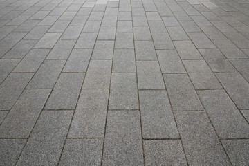 Wide neat gray slate and stone brick structure ground foreground background