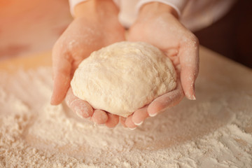 Making dough by female hands at home