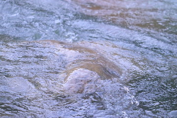 Water flowing over stone