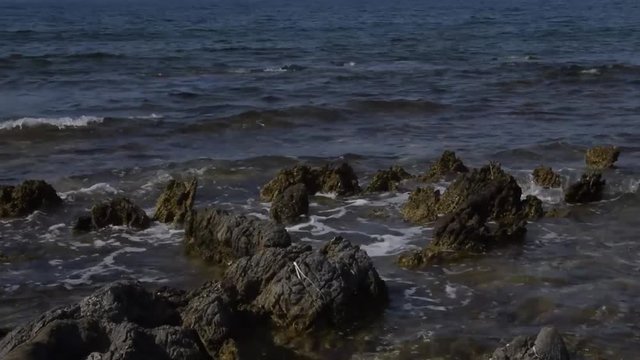 This video was shot on a bright sunny day close to San Vito lo Capo in Sicily on a rocky beach and a agitated sea